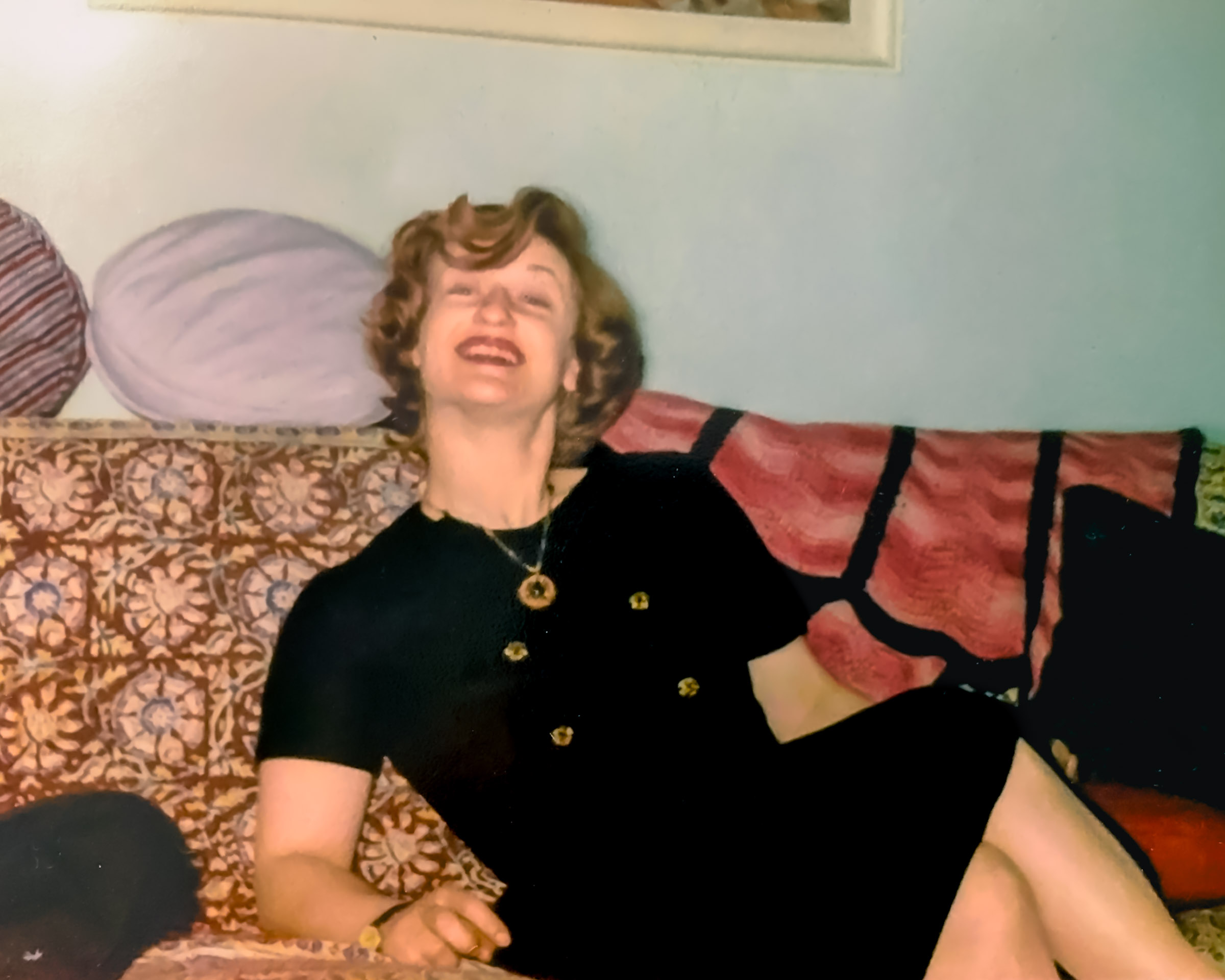 Lois Buenger laughing with friends at home